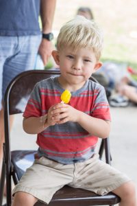 boy with Koolen-de Vries Syndrome eating popsicle